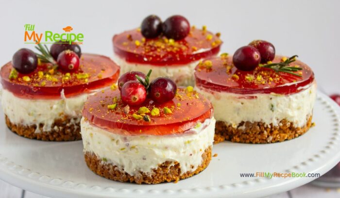 A simple mini No-Bake Pistachio Cranberry Cheesecake recipe. It features a buttery biscuit crumb base topped with a delightful mixture of cream cheese, sour cream, pistachios for dessert.