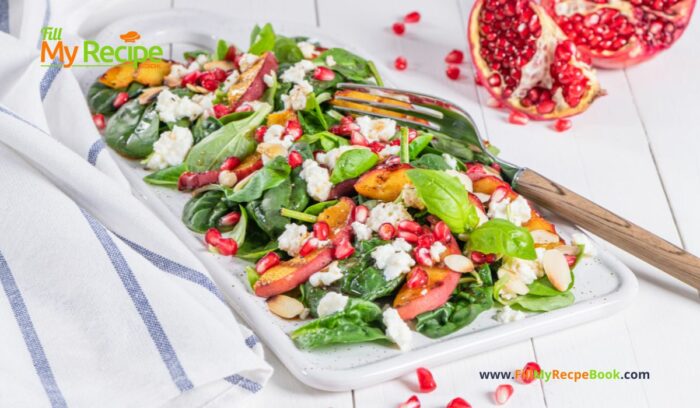 A Fresh Pomegranate Feta Salad recipe with grilled peaches and spinach leaves. A side dish or breakfast meal drizzled with a honey dressing.