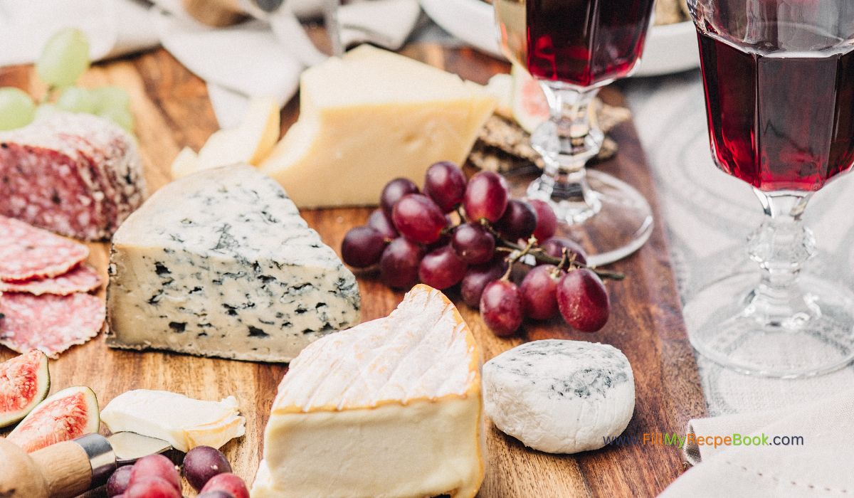 How to make Cheese Platter Appetizers. During the holiday season this board of cheeses and biscuits with fruits and wine is easily made.