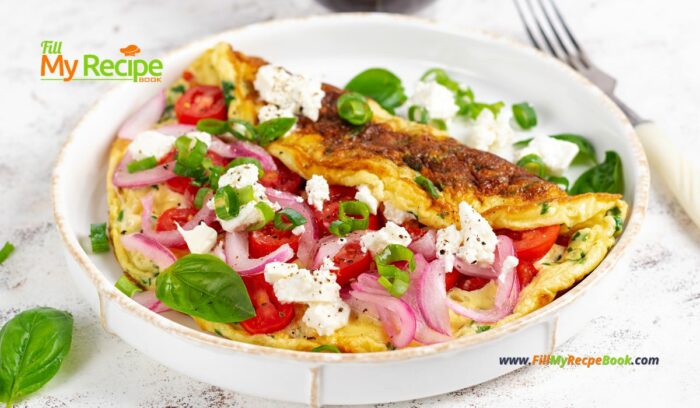 Tomato Feta Cheese Omelette Idea for breakfast. Easy homemade recipe with salad of cherry tomato, goat feta cheese and onion meal.
