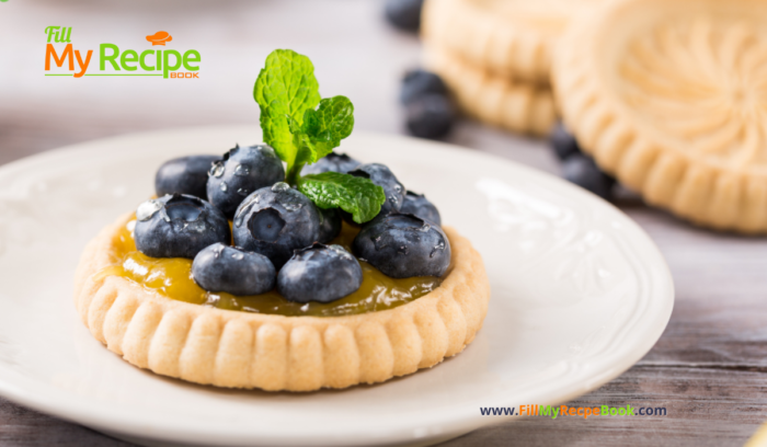 A mini Lemon Curd and Blueberry Tartlets Recipe. Oven baked dessert with shortbread crusts, filled with tangy lemon curd and blueberries.