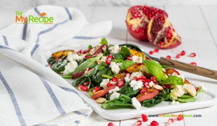 A Fresh Pomegranate Feta Salad recipe with grilled peaches and spinach leaves. A side dish or breakfast meal drizzled with a honey dressing.