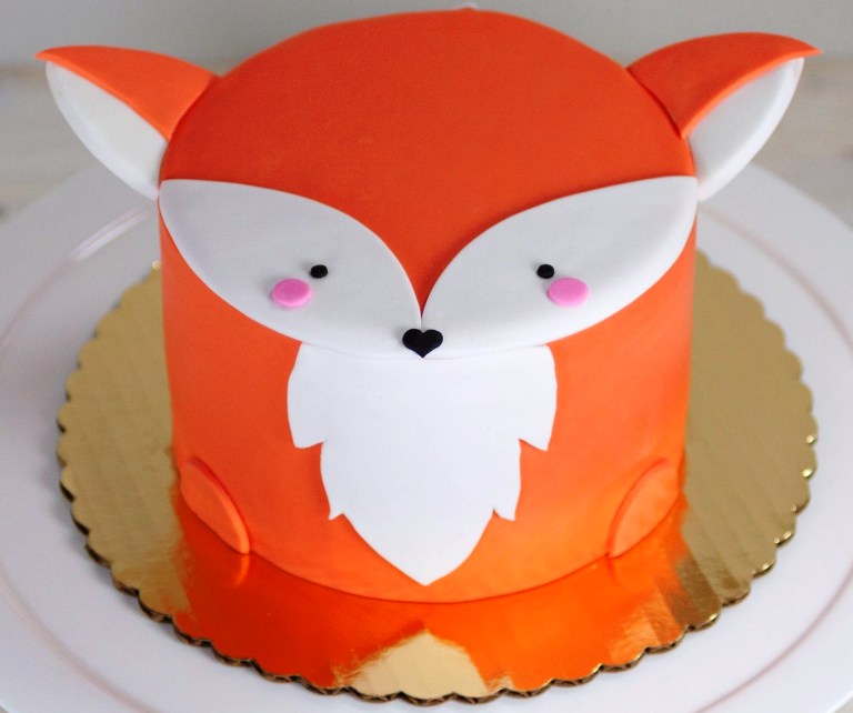 Classic vanilla cake with vanilla buttercream. Fox cake for baby shower.  Fondant is actually wilton's pre-made, and honestly tastes surprisingly  good, fyi. First time working with fondant, take it easy on me. :