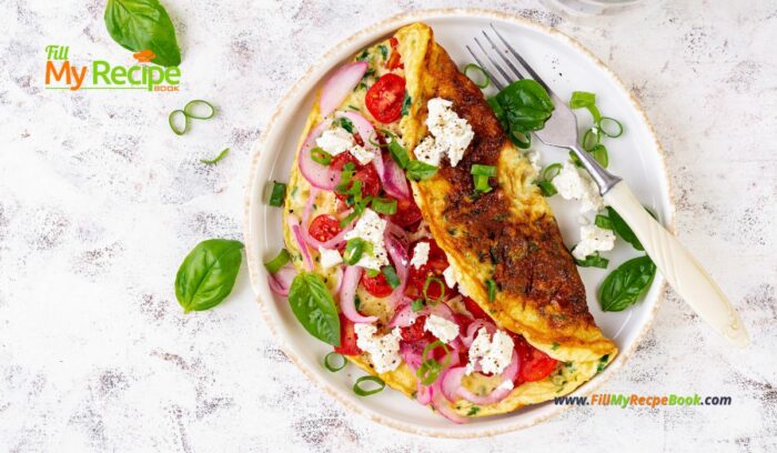 Tomato Feta Cheese Omelette Idea for breakfast. Easy homemade recipe with salad of cherry tomato, goat feta cheese and onion meal.