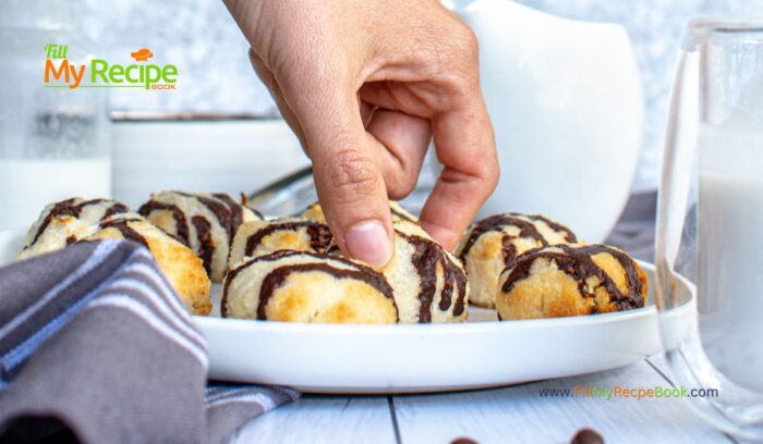 Bake these healthy Chocolate Drizzled Coconut Macaroons Recipe idea. With coconut oil and maple syrup added to the chocolate glaze.