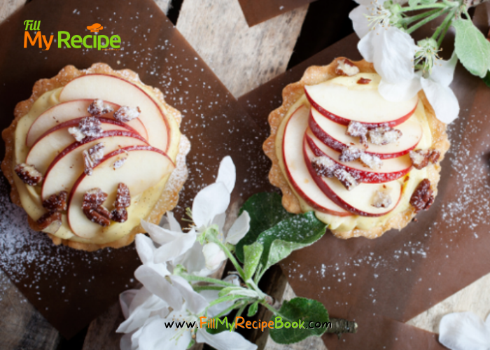 Mini Apple Cream Tartlets recipe with baked shortbread pastry for tarts. Filled with creamed apple sauce, slices of fresh apples for dessert.