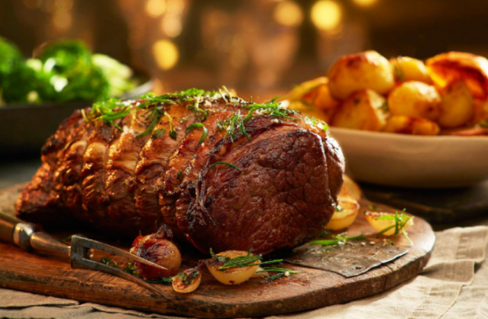 Simple Roasted Beef Recipe in the oven for dinner. Roasted beef cut with herbs and spices with onion and garlic, for gluten free meals.