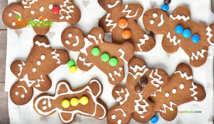 Festive and Easy Gingerbread Men Cookies Recipe Idea for a Delightful Snack. These cookies feature a soft center, crispy edges, and a spicy flavor, all beautifully decorated with a white glaze and mini M&M’s.