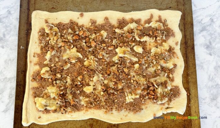 Tasty Banana Granola Cinnamon Roll recipe idea. Easy breakfast buns, quick with bought crescent sheets, or homemade dough with fillings.