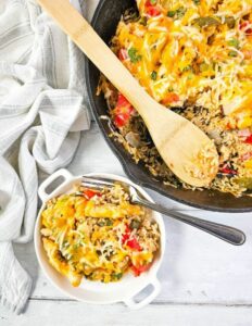 Easy Chicken Fajita Casserole Recipe in an iron skillet pan. The best go to dinner or lunch idea to cook on stove top then bake in the oven.