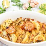 Easy Lemon Greek Potatoes Recipe for an oven bake idea. Homemade potato wedges with vegetable broth, garlic for a warm side dish for meals.