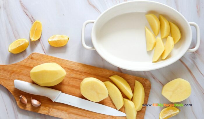 prep for the dish, Easy Lemon Greek Potatoes Recipe for an oven bake idea. Homemade potato wedges with vegetable broth, garlic for a warm side dish for meals.