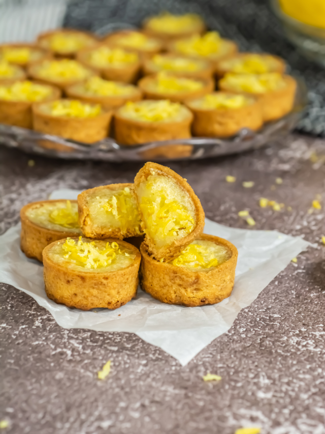 Mini Lemon Custard Tart Recipe idea. Oven Baked in pre bought crusts with sour cream and egg filling, garnished with lemon zest for dessert.