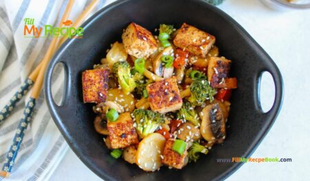 Easy Tofu Veggie Stir Fry Recipe idea with honey and sesame seeds. A no bake healthy vegan or vegetarian meal with udon noodles.