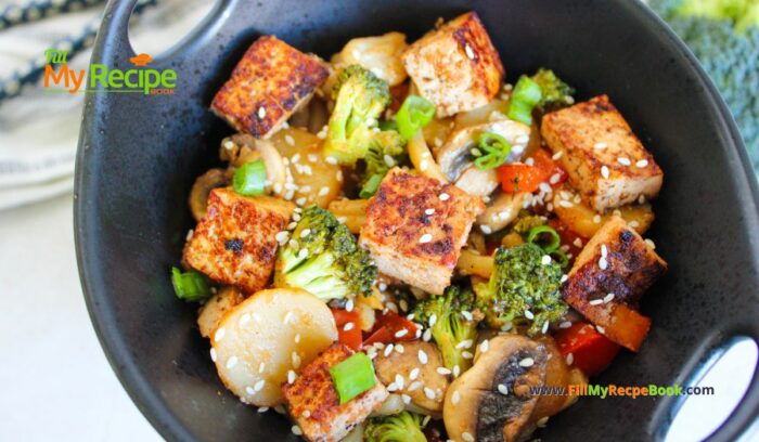 Easy Tofu Veggie Stir Fry Recipe idea with honey and sesame seeds. A no bake healthy vegan or vegetarian meal with udon noodles.