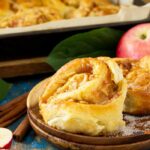 Homemade Apple Cinnamon Rolls recipe with white glazing. Easy dessert filled with sliced sweet apple, and brown sugar for a breakfast snack.