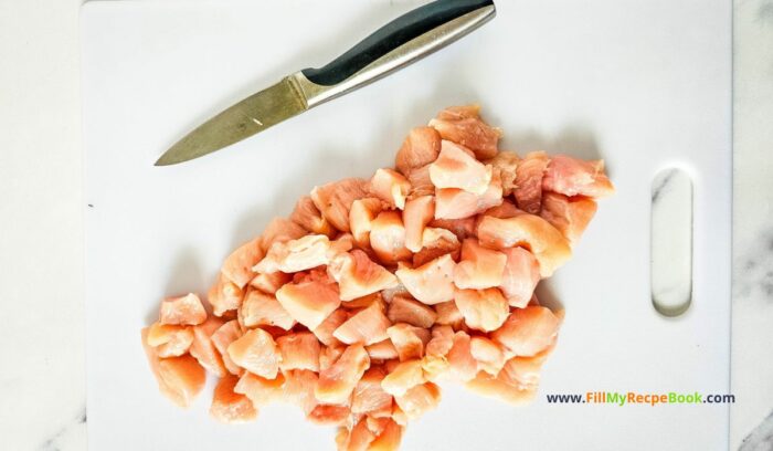 cutting the chicken into pieces to be edible. for Iron Skillet Chicken Alfredo Casserole recipe. An easy creamy pasta bake for quick night dinners or lunch the family will love.