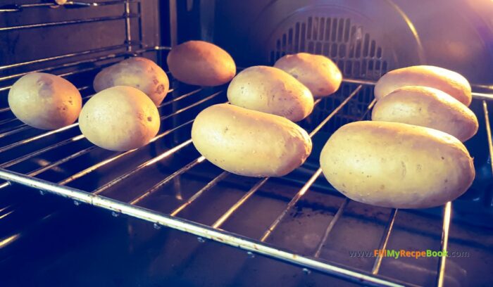 baking whole potatoes for Loaded Baked Potatoes Grilled recipe. Easy homemade potato jackets filled with cream cheese and bacon bits topped with cheddar for a meal.