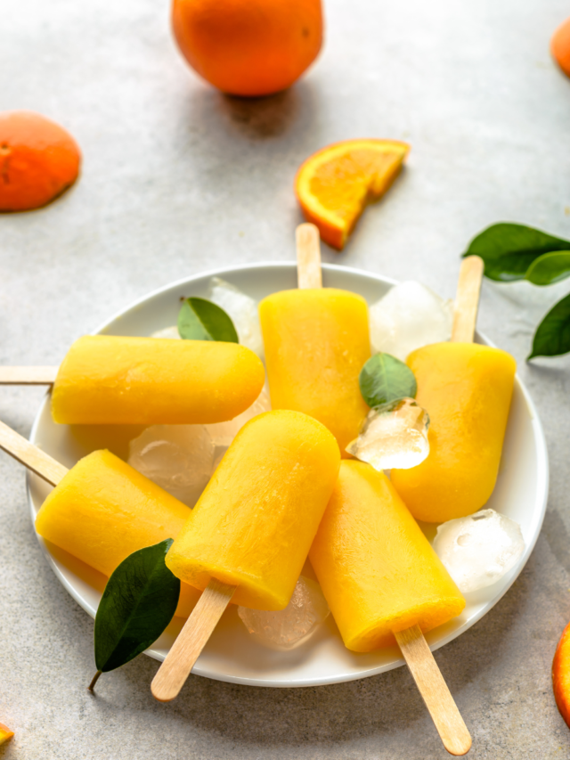 Simple Homemade Orange Popsicles recipe. A Summer time snack with fresh orange juice, frozen ice cream for kids and adults to enjoy.