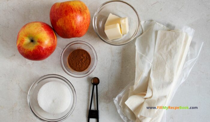 ingredients for Apple Strudel Slices Recipe to have for a sweet dessert. Simple homemade from scratch idea with wrapped phyllo dough on apple rounds, snack.