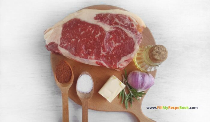 The ingredients for this recipe, Best Grilled Ribeye Steak recipe in a cast iron pan. Easy stove top idea for dinner or lunch as the steak is grilled with butter, garlic.