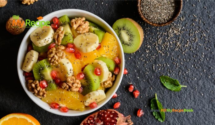 Healthy Kiwi Fruit Salad with Walnuts with pomegranate, orange pieces, banana, chia seeds. An easy recipe idea to create for a winter salad.