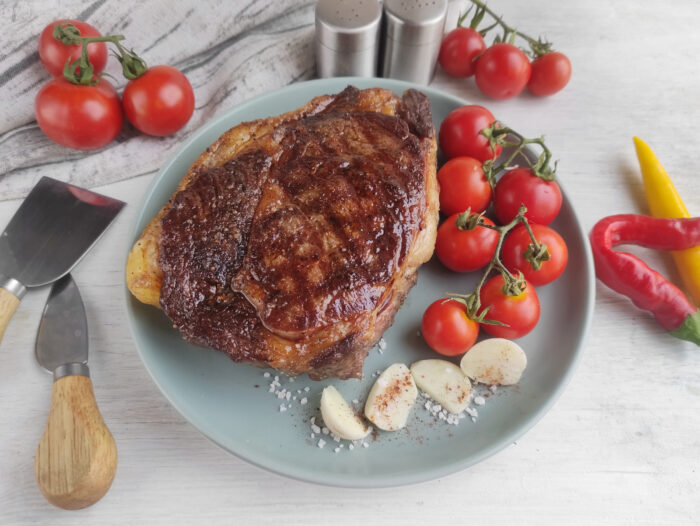 Best Grilled Ribeye Steak recipe in a cast iron pan. Easy stove top idea for dinner or lunch as the steak is grilled with butter, garlic.