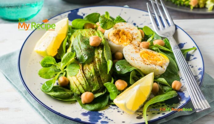 Avocado Spinach Chickpeas Eggs Salad recipe idea for a protein filled lunch that is ready in five minutes, drizzled with lemon and olive oil.