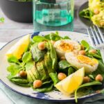 Avocado Spinach Chickpeas Eggs Salad recipe idea for a protein filled lunch that is ready in five minutes, drizzled with lemon and olive oil.