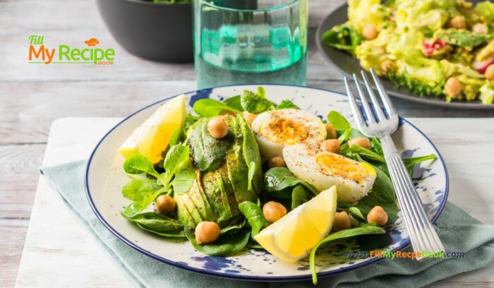 Avocado Spinach Chickpeas Eggs Salad recipe idea for a protein filled lunch that is ready in five minutes, drizzled with lemon and olive oil.