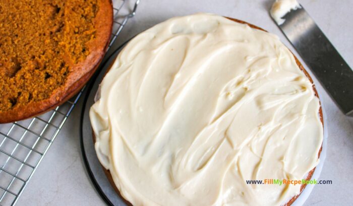 frosting and putting the cake together. Best Pumpkin Cake recipe with salted caramel cream cheese frosting. A delicious dessert using pumpkin puree, pumpkin spices for fall treat.