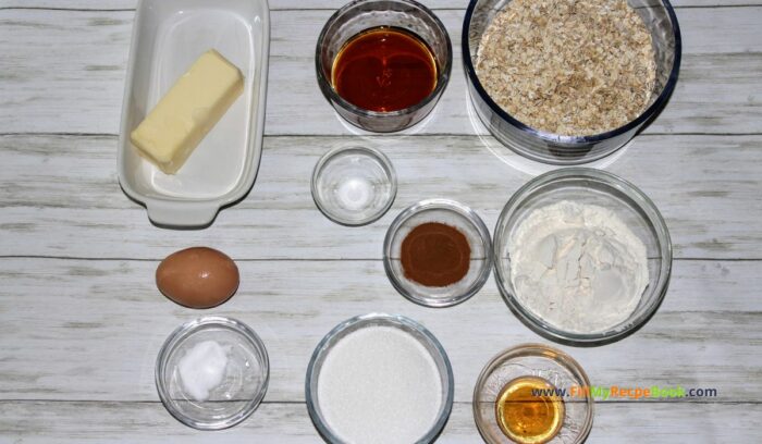 the ingredients for these oat cookies, quick oats. flour quick oats, salt and soda, cinnamon, soft butter, sugar maple syrup, egg and vanilla.

