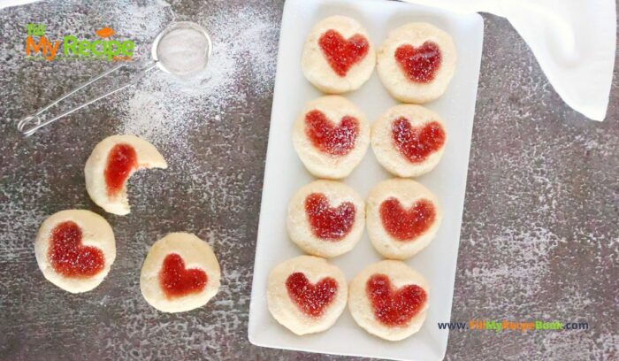 Strawberry Heart Thumbprint Cookies recipe. An easy dough mix idea and strawberry jam or puree filling for a snack at Christmas holidays.