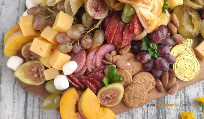 Best Charcuterie Board with Cornucopia recipe idea for Thanksgiving. Bake the easy puff pastry horn and add some fruits, various cheeses.