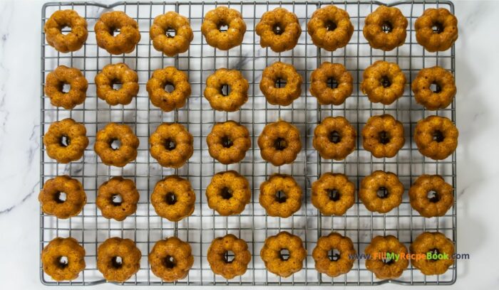 cooling These Mini Pumpkin Bundt Cakes recipe are spicy and made from scratch. An easy bake,  with vanilla butter icing, makes a moist dessert.