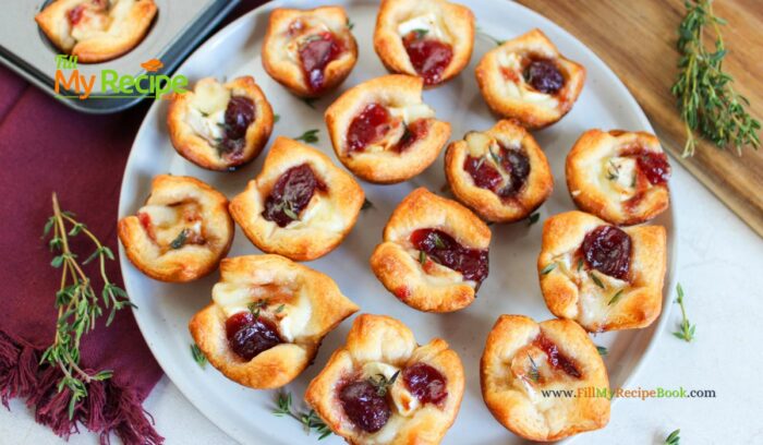 The most delicious mini Cranberry Brie Puff Pastry Bites appetizer recipe idea. Simple to make ahead for a sweet and savory holiday snack.