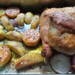 An oven Roasted Parmesan Potato Butternut and Chicken recipe for a meal. Delicious all in one pan, half a chicken and vegetables for lunch.