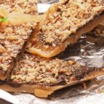 Homemade Chocolate Toffee Almond Bars on a shortbread base recipe. An easy candy topped cookie bar that taste like toffee, with nuts for snacks.