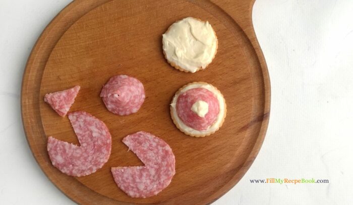 salami and cream cheese hats for a santa appetizer or snack for festive holidays during Christmas and new year