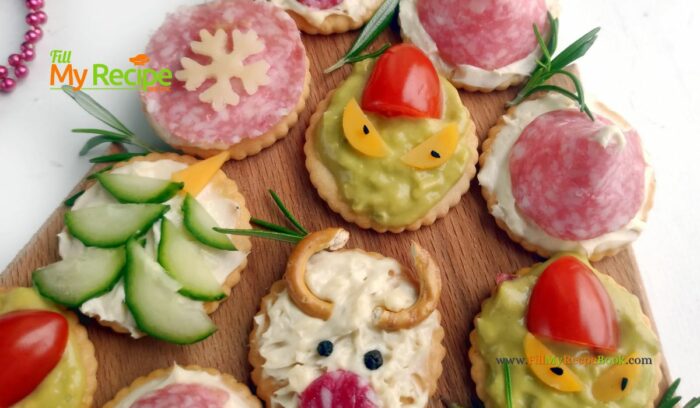 Simple Christmas Cracker Appetizers recipe ideas for snacks and treats. Crackers garnished with cream cheese, salami, cucumber, cherry tomato.