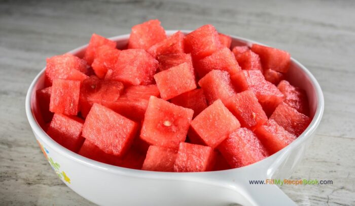 watermelon sliced and cut into small bitable squares for a one bite  snack on a skewer with feta for a delicious treat in the summer with a dip or glaze