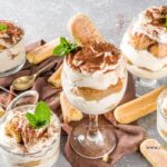 Delicious Tiramisu Trifle in a Glass for individual servings as a dessert. A mini trifle made with finger biscuits, mascarpone cream, and espresso.