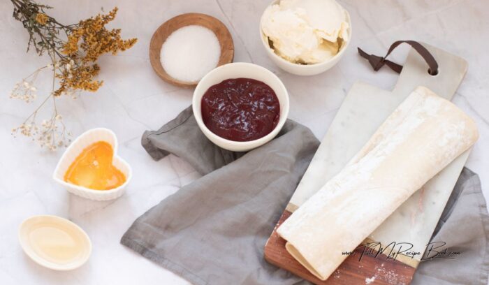 the simple ingredients, bought puff pastry and jam with fine white sugar and cream cheese, make a tasty yet now sweet snack when bakes for tea