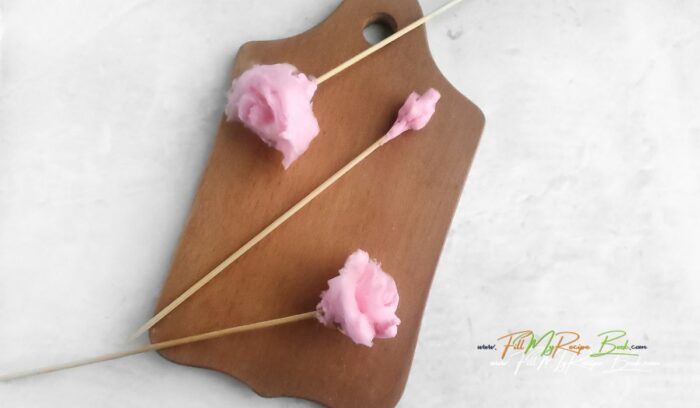 cotton candy flower on a skewer, for this Learn how to make a Valentine's Day DIY Candy Bouquet idea to create for a special someone. A beautiful packaged gift to suit anyone.