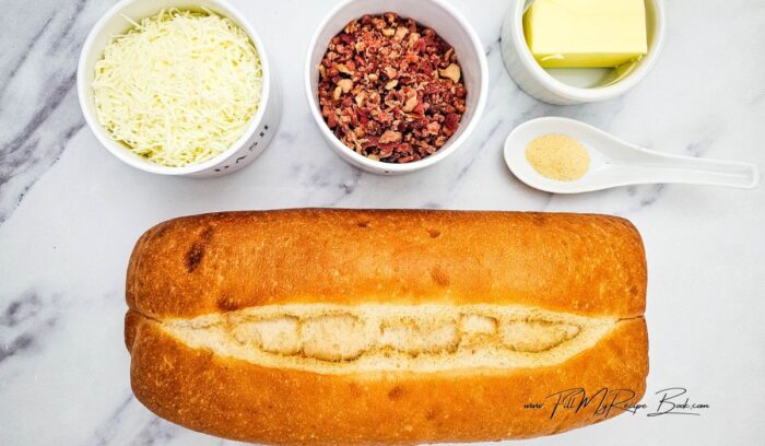 Ingredients for Savory Bacon Cheese Pull Apart Bread.
loaf of Italian bread (or French large loaf)
butter (to melt )
garlic powder
mozzarella cheese and cheddar cheese.(a mix)
package bacon pieces (cooked)