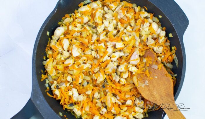 Sauté the veggies and the chicken and spice them with the paprika, cumin, black pepper, salt and and garlic. Fry until tender and the chicken is cooked.