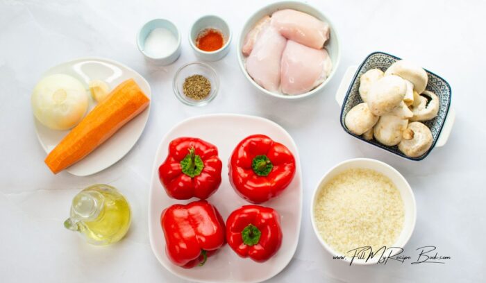 the ingredients for this chicken and rice stuffed bell peppers recipe.
vegetables are onion, carrots mushrooms, garlic bell peppers, skinless and debones chicken. paprika, salt and pepper and cumin, garlic.