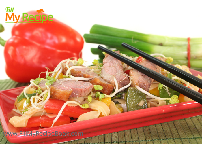 Crispy Chinese Duck Breast recipe with noodles and sauce. An easy fine dining meal, seared duck breast with alfalfa sprouts, bell peppers.