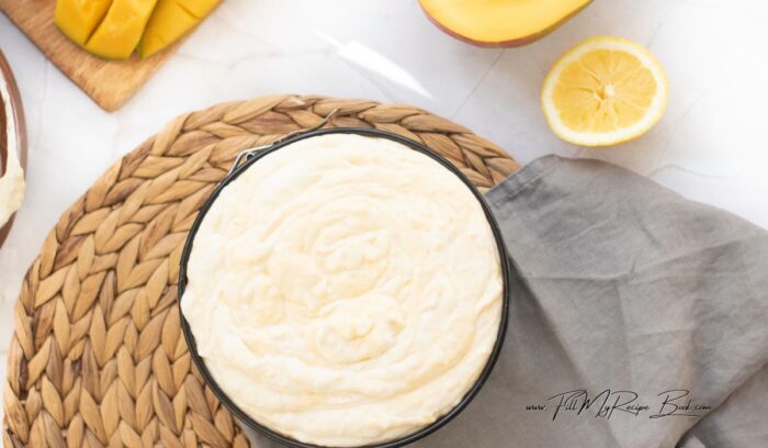 In a large mixing bowl, beat the cream cheese with a spatula to soften, until smooth. Add the powdered sugar and vanilla extract, beating until well combined. Mix in mango puree and lemon juice until the mixture is smooth. Gently fold in the whipped cream until the filling is light and airy. Pour the filling over the crust, spreading it evenly. Refrigerate for at least 4 hours or until set.