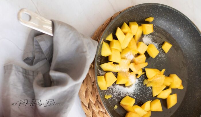 In a saucepan, combine the diced mango, sugar, and lemon juice. Cook over medium heat until the mango is softened, and the sugar is dissolved.